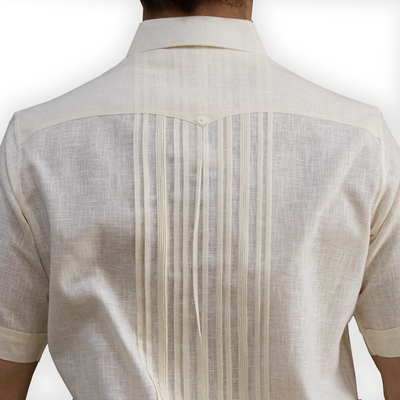 man wearing cream short sleeve guayabera shirt