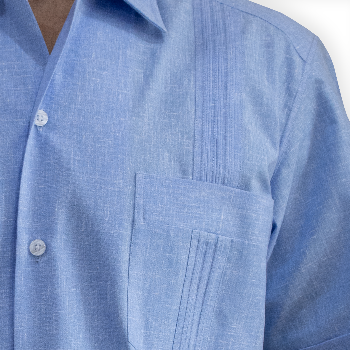 man wearing cuban light blue short sleeve guayabera