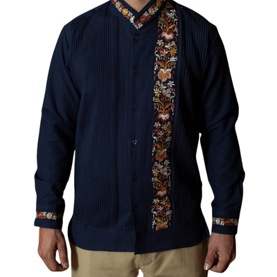 man wearing dark indigo guayabera with mao collar and embroidery