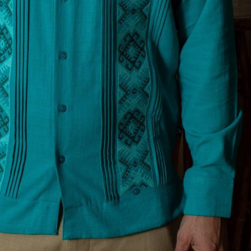 man wearing jade green short sleeve guayabera shirt