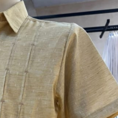 man wearing light beige short sleeve guayabera