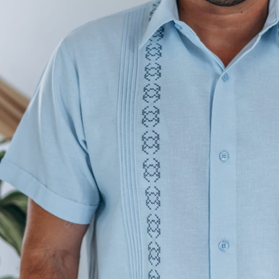 man wearing light blue classic guayabera shirt