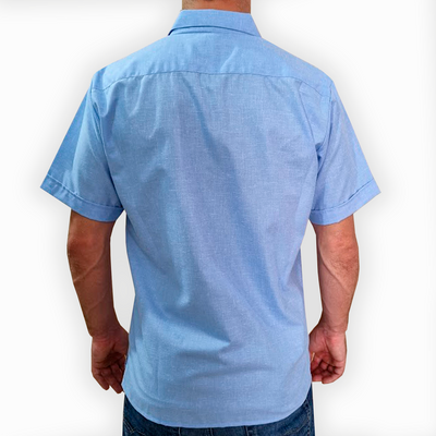 man wearing light blue short sleeve guayabera shirt