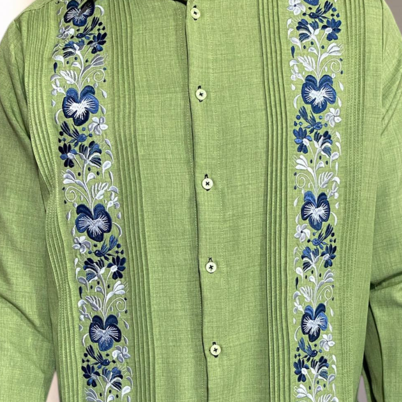 man wearing light green embroidered guayabera short sleeve