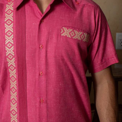 man wearing mexican pink guayabera shirt
