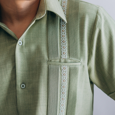 man wearing olive green short sleeve guayabera