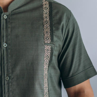 man wearing olive green short sleeve guayabera