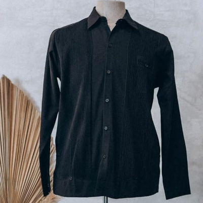 man wearing presidential black guayabera
