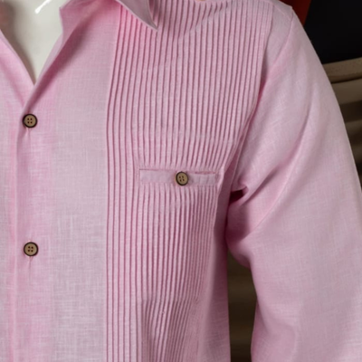 man wearing presidential pink guayabera
