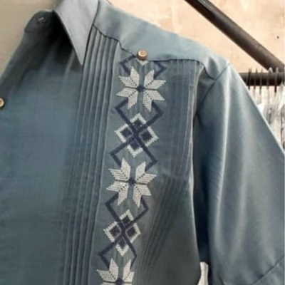 man wearing slate blue guayabera shirt