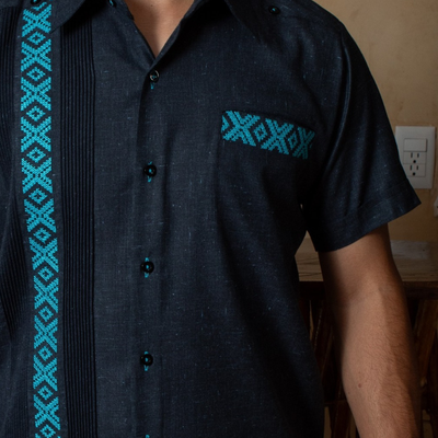 turquoise hand embroidery on dark blue guayabera